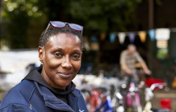 Smiling older woman with her glasses on her head