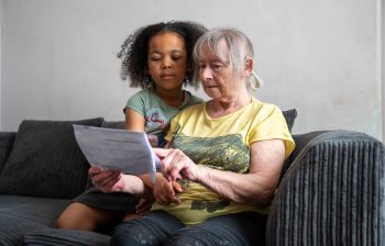 Older woman with grandchild in her home