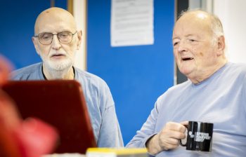 Two older men talking